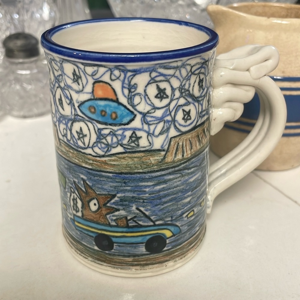TOM EDWARDS POTTERY “WALLY SELLS HIS 600 SQ. FT DOGHOUSE MUG….